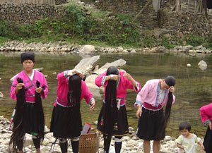 Longji Trerrace Field Yao women washing their longest hair in the world