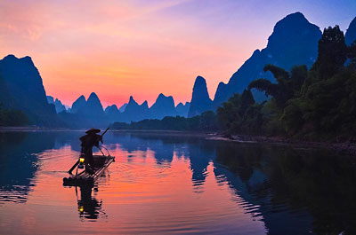 Fisherman on Li River at sunset